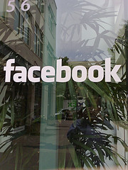 A window on front of Facebook offices in Palo Alto