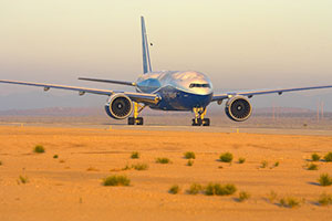 Boeing 777-200LR landing in the desert photo
